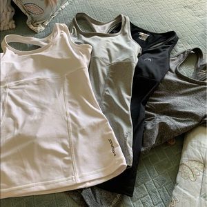 Lot of 4 HEAD work out shirts.